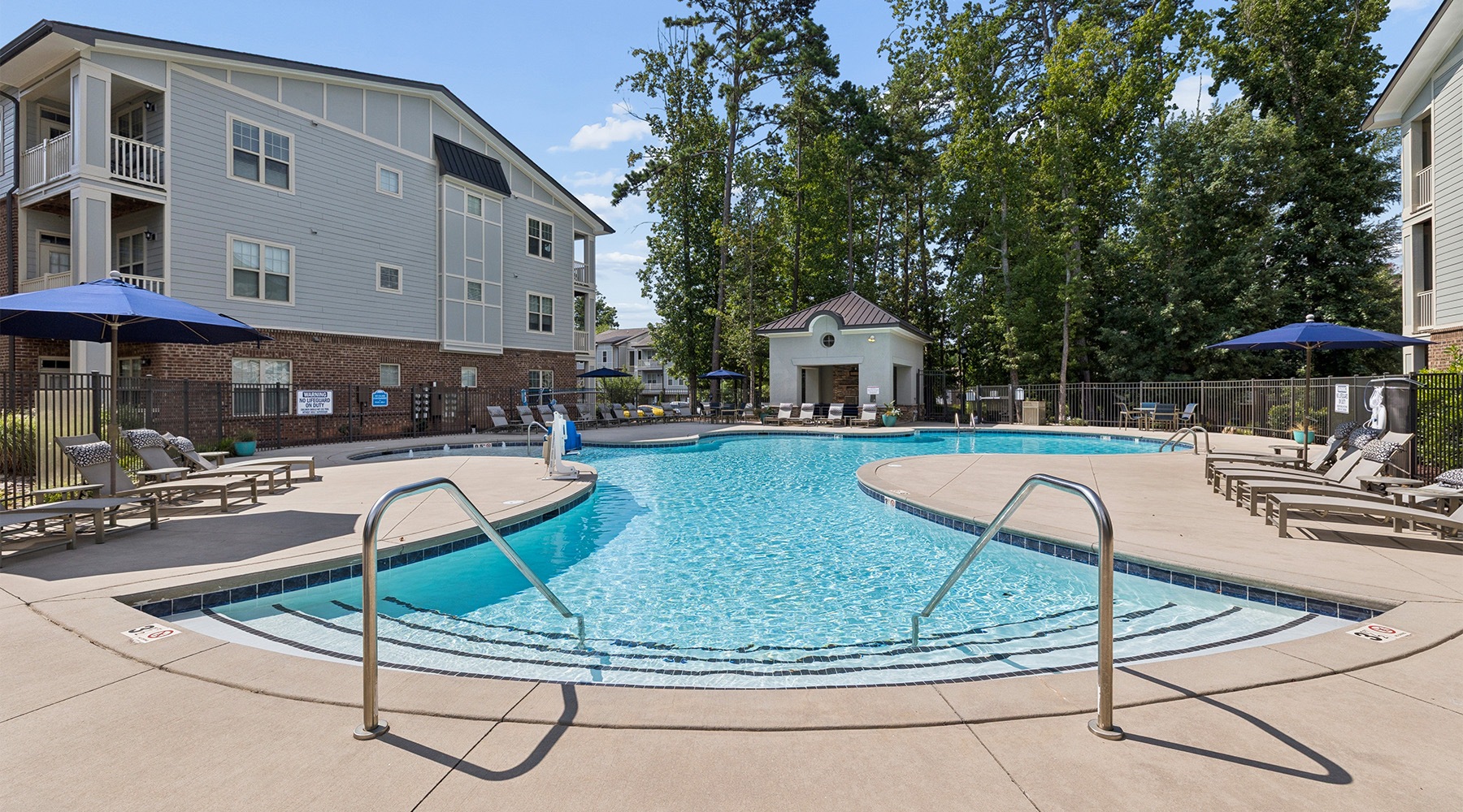 a pool with chairs around it