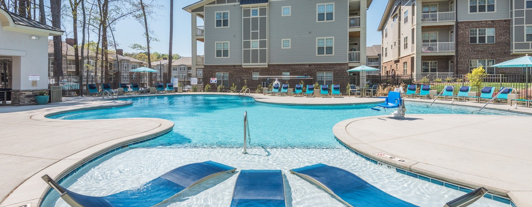 a pool with chairs around it